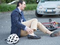 Aching man after bicycle accident Royalty Free Stock Photo