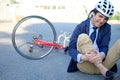 Aching man after bicycle accident Royalty Free Stock Photo