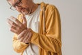 Aching wrist pain as symptom of tendonitis or arthritis