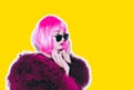 Acid crazy hot beautiful rock Girl in bright pink wig and sunglasses in lama leather swag style red fur winter coat