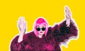 Acid crazy hot beautiful rock Girl in bright pink wig and sunglasses in lama leather swag style red fur winter coat Royalty Free Stock Photo