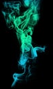 Acid neon cyan light blue green smoke on black background Royalty Free Stock Photo