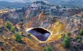 Acid red lake and colorful rocks in abandoned copper mine pit near Kampia, Cyprus