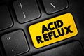 Acid reflux - common condition that features a burning pain, known as heartburn, in the lower chest area, text button on keyboard