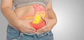 Acid reflux or stomach is on the woman`s body gray Background.