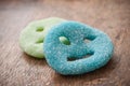 Acidulous candies in shaped smiley on wooden backgrou Royalty Free Stock Photo