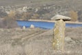 Acient stone pillar on the slopes of the river Ingul, in Ukraine. Rocks of the Mesozoic geological era. Landscape of steppe slopes