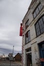 The Acme Farm Supply Building with old white brick on a cloudy day in Nashville Tennessee Royalty Free Stock Photo