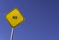 aco - yellow sign with blue sky background