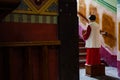 Acolyte with donation box for gifts in church