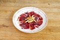 Acorn-fed ham tapas with croutons on a white plate Royalty Free Stock Photo