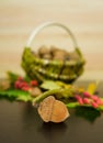 Acorns on a wooden table in the background basket with acorns Royalty Free Stock Photo