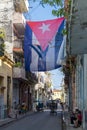 Acosta street of old Havana the Cuban flag