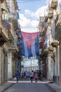 Acosta street of old Havana the Cuban flag