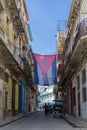 Acosta street of old Havana the Cuban flag