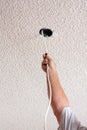 Acoustic ceiling with electric wire hanging Royalty Free Stock Photo