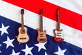 Acoustic, electric and bass guitar on American flag background. Minimal concept, top view. Royalty Free Stock Photo