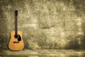 Acoustic guitar against old wall Royalty Free Stock Photo
