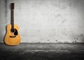 Acoustic guitar against old wall Royalty Free Stock Photo