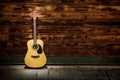 Acoustic guitar against rusty gates Royalty Free Stock Photo