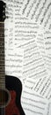 Acoustic guitar on a background sheet notes Royalty Free Stock Photo
