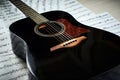 Acoustic guitar on a background sheet notes Royalty Free Stock Photo