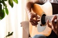 Acoustic guitar body background and hands playing of man room Royalty Free Stock Photo