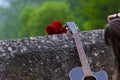 Acoustic guitar and bouquet of red roses Royalty Free Stock Photo