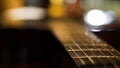 Acoustic guitar bridge and strings close up. Close-up of guitar strings. Elegant guitar Royalty Free Stock Photo