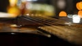 Acoustic guitar bridge and strings close up. Close-up of guitar strings. Elegant guitar Royalty Free Stock Photo