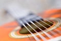 Acoustic guitar bridge and strings close up Royalty Free Stock Photo