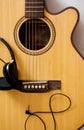 Acoustic guitar close up and headphone