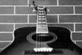 Acoustic guitar closeup over brick wall background Royalty Free Stock Photo