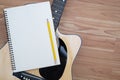 Acoustic guitar concept, the guitar body pattern is wood grain. Royalty Free Stock Photo