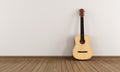 Acoustic guitar in a empty room Royalty Free Stock Photo