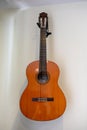 Acoustic guitar hanging decorative on wall Royalty Free Stock Photo