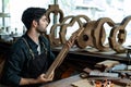 Acoustic Guitar Luthier Inspecting Guitar Neck Bend or Straight Royalty Free Stock Photo