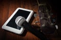 Acoustic guitar with microphone and computer tablet. Royalty Free Stock Photo