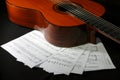 Acoustic guitar with music sheets Royalty Free Stock Photo