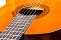 Acoustic guitar neck with body and strings on white background in close-up Royalty Free Stock Photo