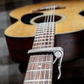 Acoustic guitar neck with a capo Royalty Free Stock Photo