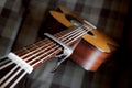 Acoustic guitar neck with a capo Royalty Free Stock Photo