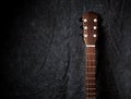 An Acoustic Guitar Neck on dark Cloth Background Royalty Free Stock Photo