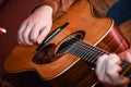 Acoustic Guitar Playing. closeup Men hands Playing Acoustic Guitar Royalty Free Stock Photo