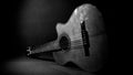 Acoustic guitar resting on the floor