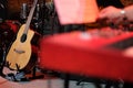 Acoustic guitar on stage among musical instruments Royalty Free Stock Photo
