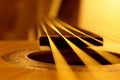 Acoustic guitar strings closeup, warm colors and abstract view Royalty Free Stock Photo