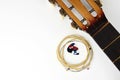 Acoustic guitar strings and pick on white background Royalty Free Stock Photo