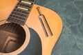 Acoustic guitar and tuning fork Royalty Free Stock Photo