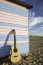 Acoustic guitar on vacation Royalty Free Stock Photo